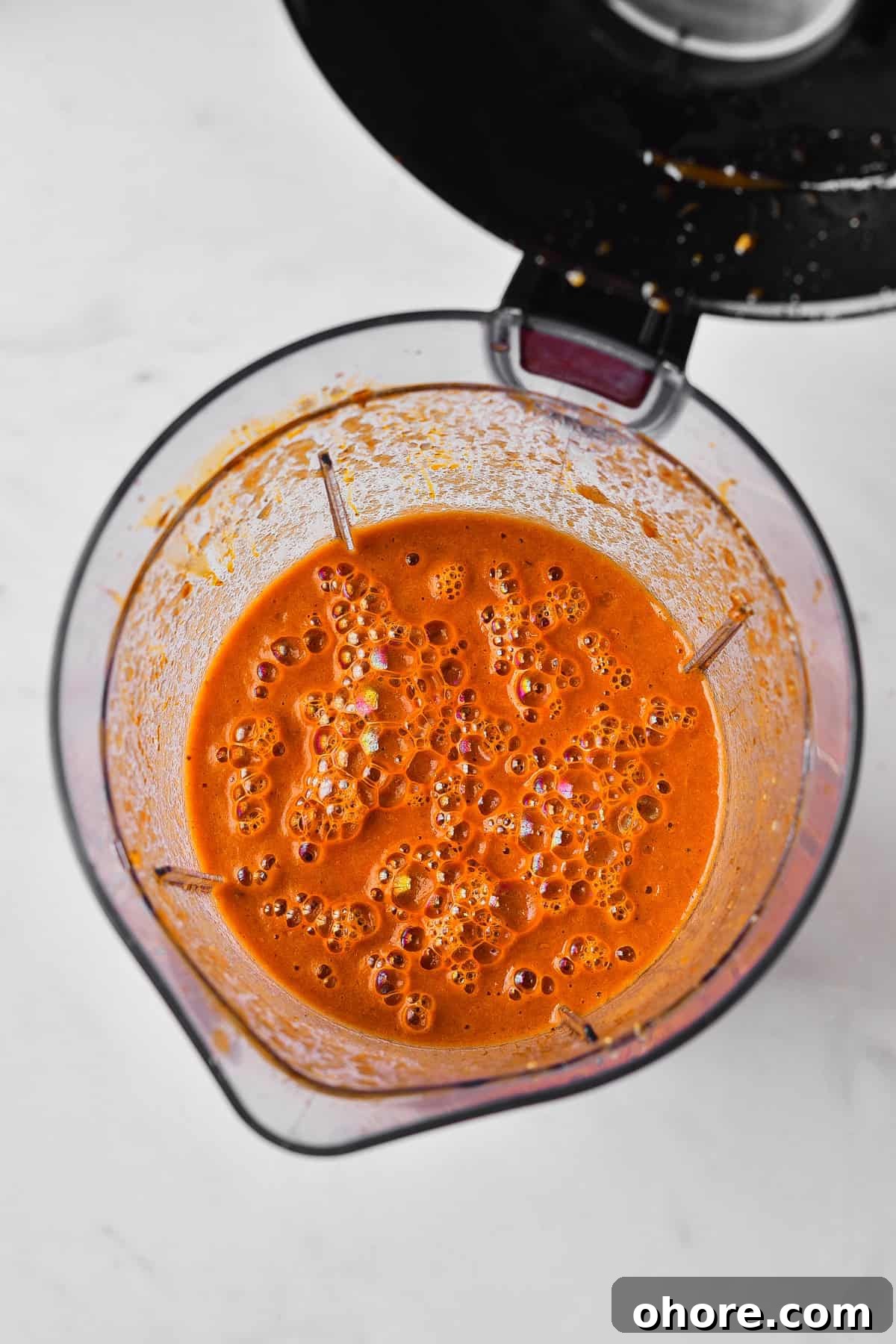 Authentic Chicken Tinga Recipe — Classic Tinga de Pollo 8 Blended sauce in pitcher.
