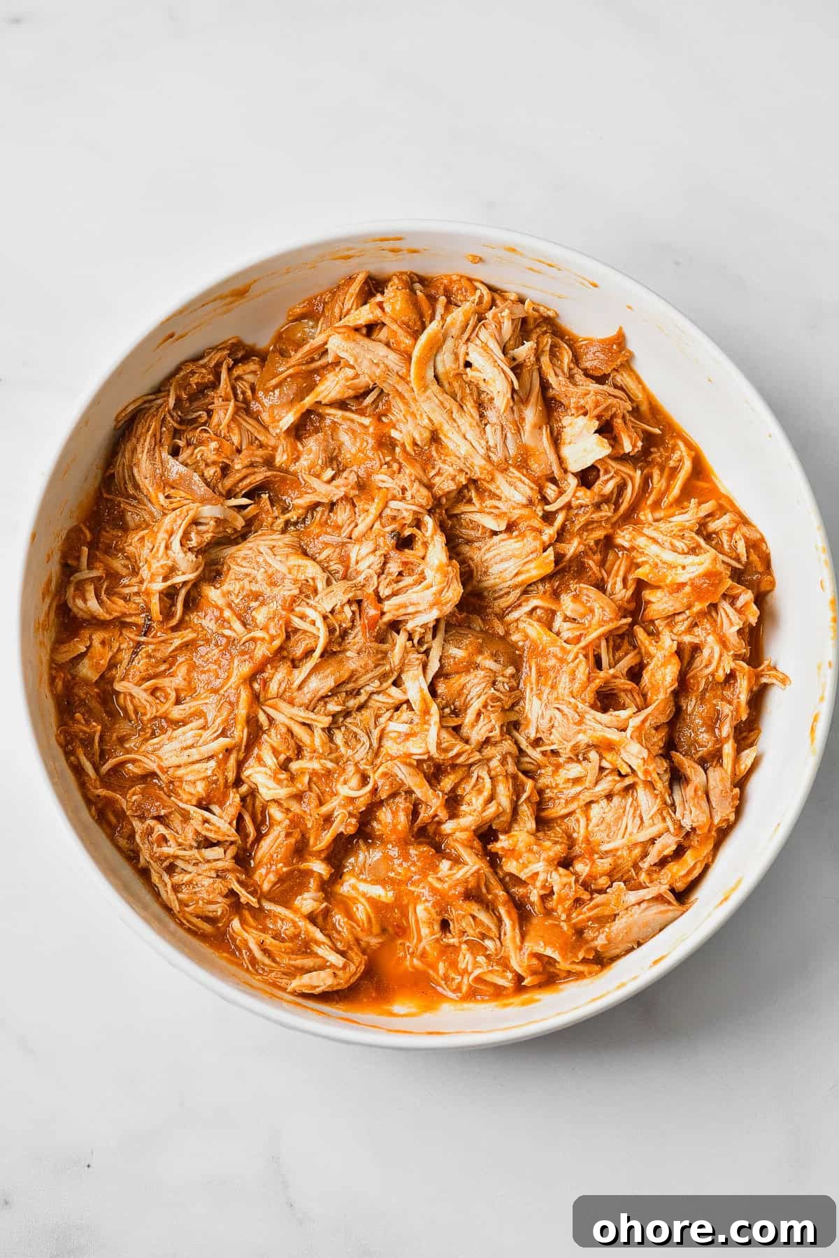Authentic Chicken Tinga Recipe — Classic Tinga de Pollo 9 The shredded chicken in the tinga sauce.