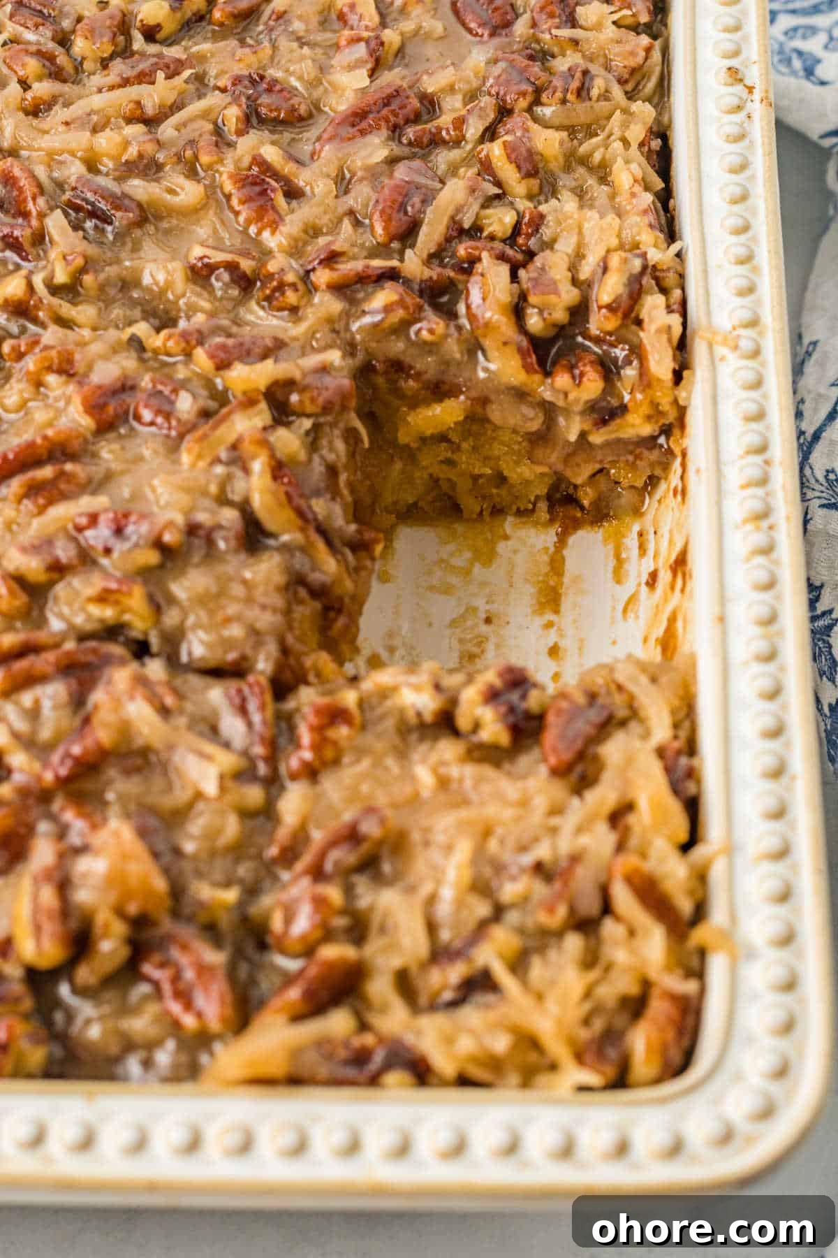 Swirl Cake Recipe: How to Make a Tornado Marble Cake 6 A pan of cake with a piece missing.