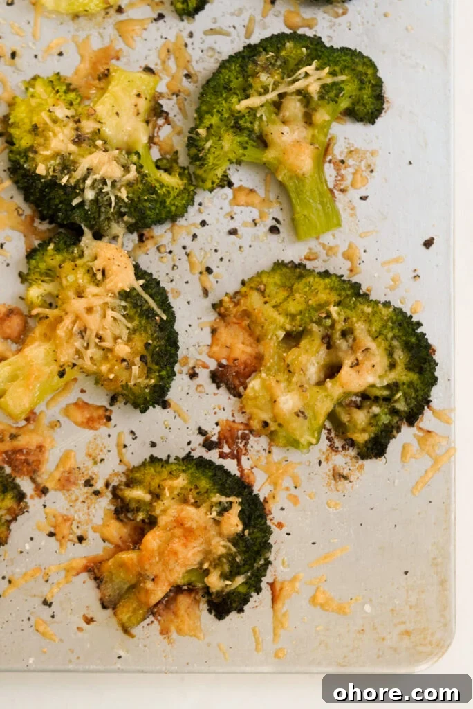 Crispy Smashed Broccoli with Parmesan and Garlic 12 flat lay shot of a baking sheet with parmesan smashed broccoli florets.
