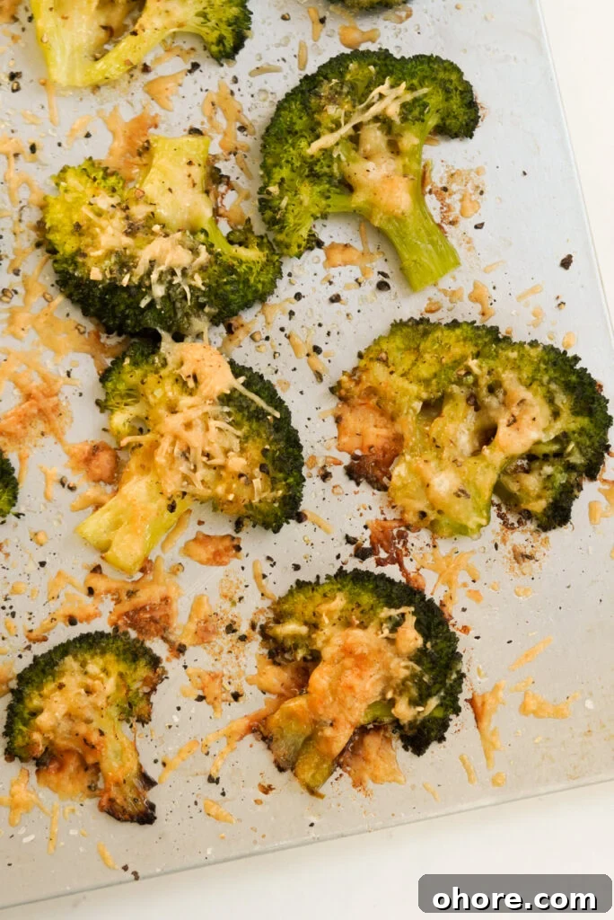 Crispy Smashed Broccoli with Parmesan and Garlic 15 baking sheet with parmesan smashed broccoli.