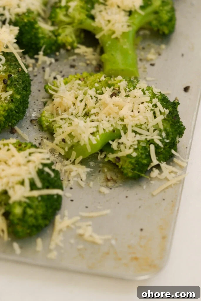 Crispy Smashed Broccoli with Parmesan and Garlic 9 grated parmesan on top of smashed broccoli florets before baking.