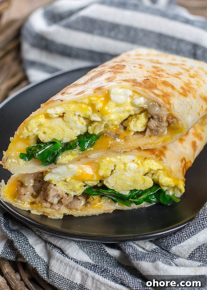 This Sausage Burrito is packed with sausage, eggs, cheese and spinach! This meal is super satisfying and is perfect for meal prep!