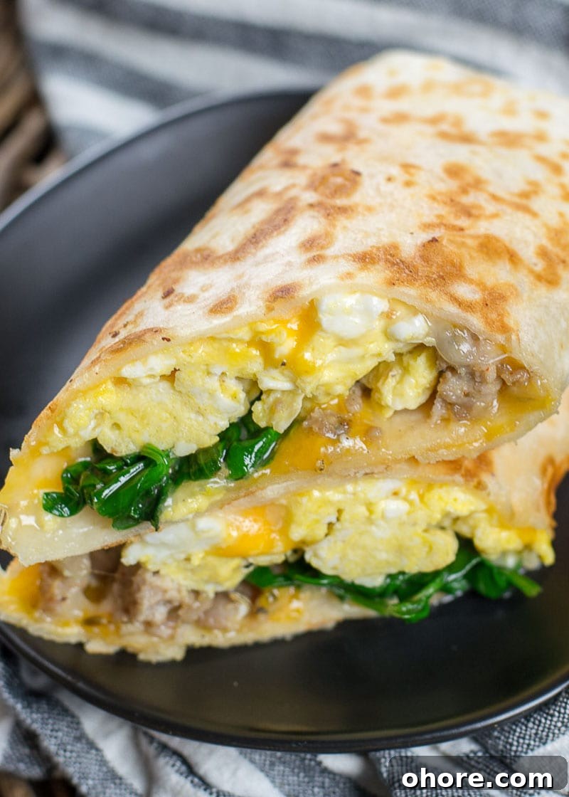 This Sausage Burrito is packed with sausage, eggs, cheese and spinach! This meal is super satisfying and is perfect for meal prep!