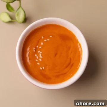 Vibrant looking gochujang mayo in a bowl.