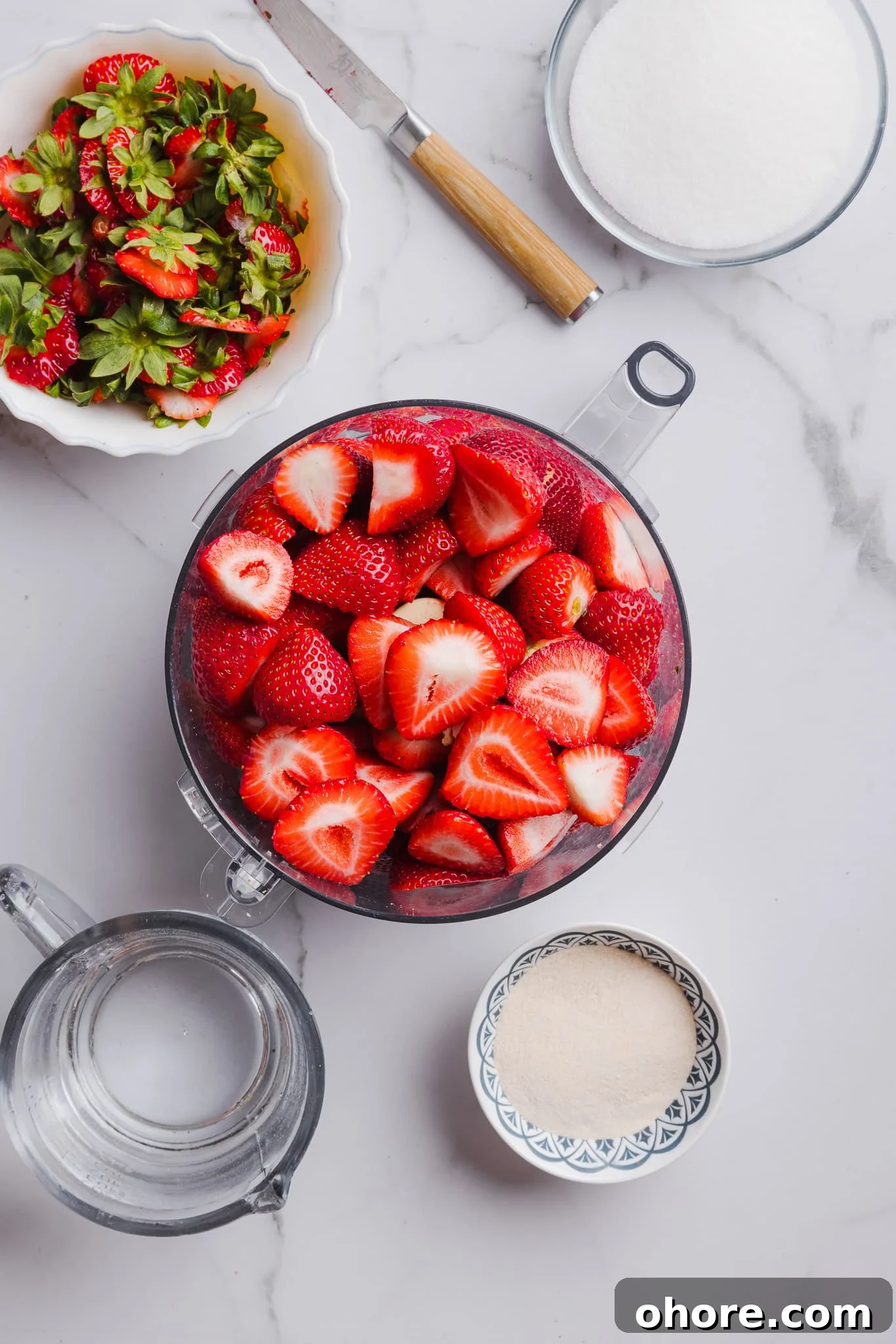 Fresh strawberries in a food processor.