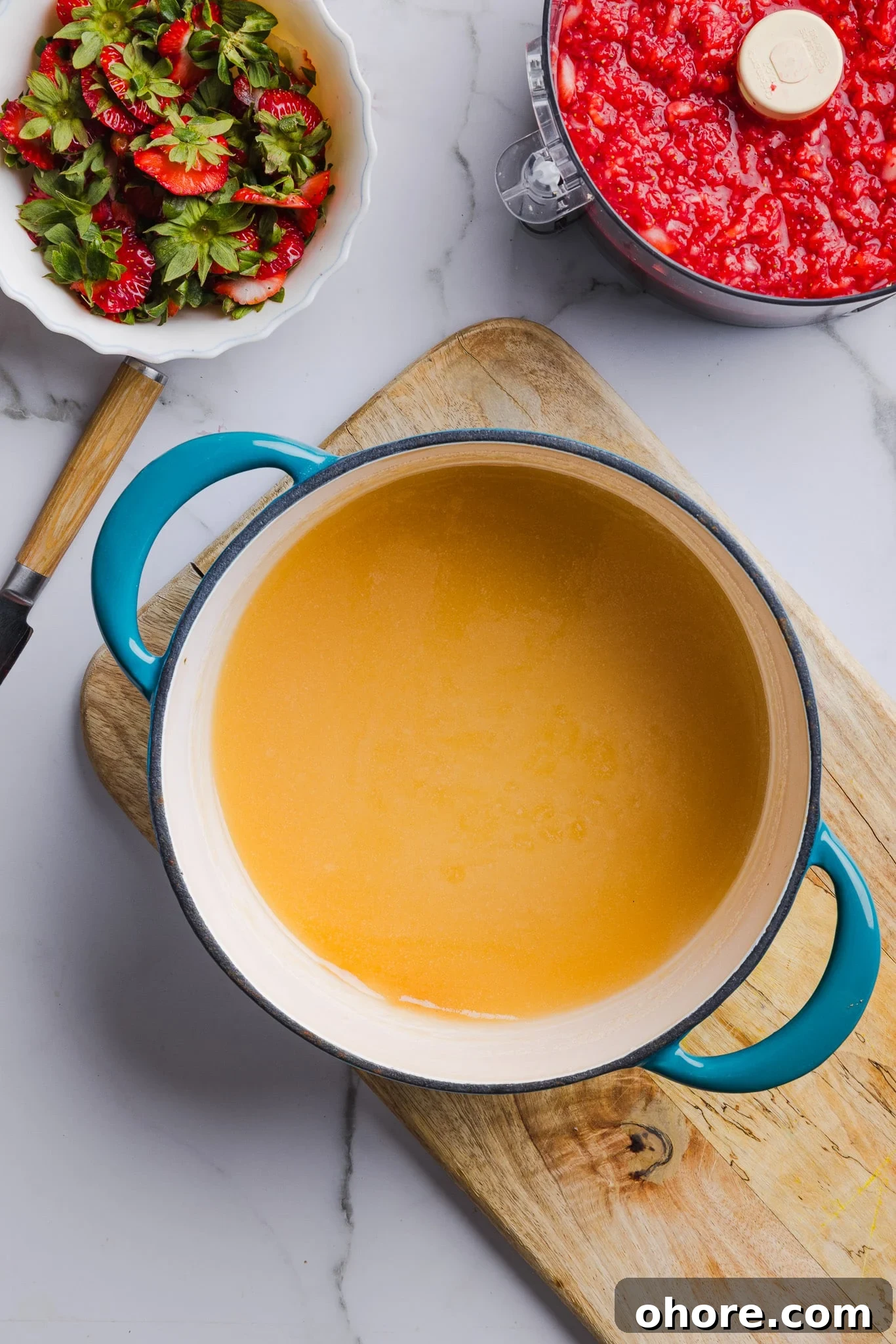 Low sugar pectin and sugar mixed together in a saucepan.