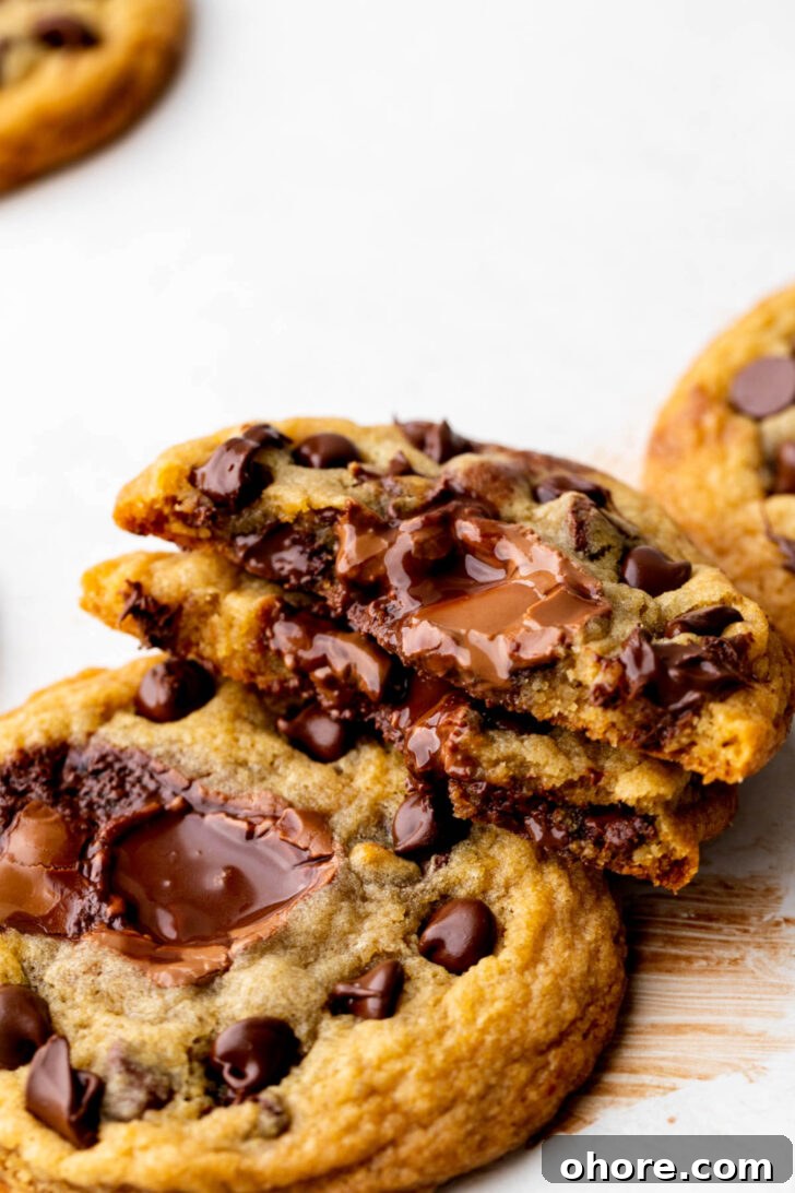 One lindt stuffed cookie split in half to show the inside.