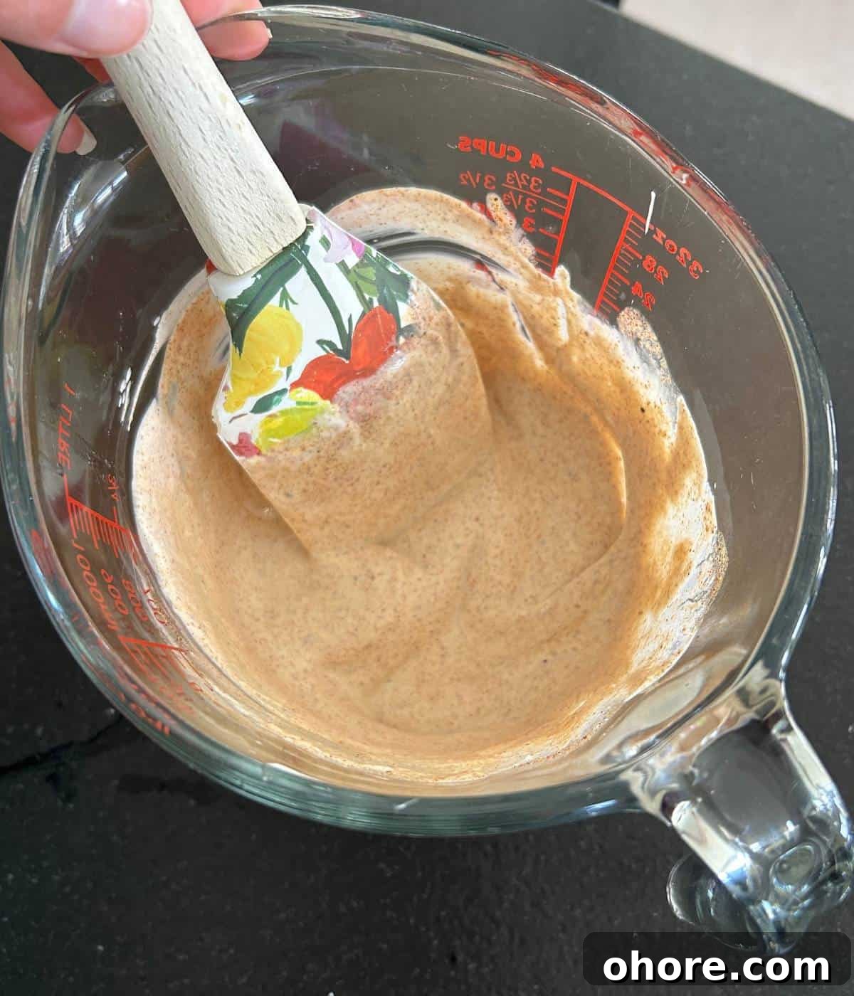 Sour cream and lime sauce in pyrex dish.