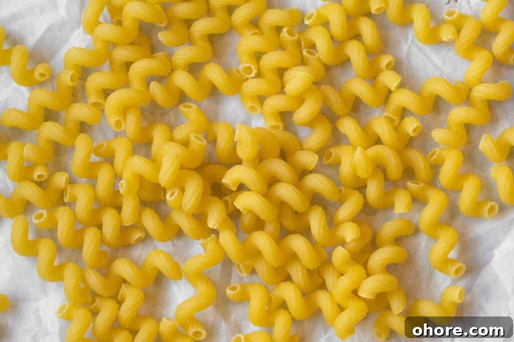 Roasted Cauliflower Mac and Cheese Casserole Recipe 5 close up of cavatappi shaped pasta
