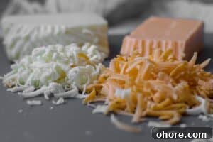 Roasted Cauliflower Mac and Cheese Casserole Recipe 7 grated cheese on a cutting board