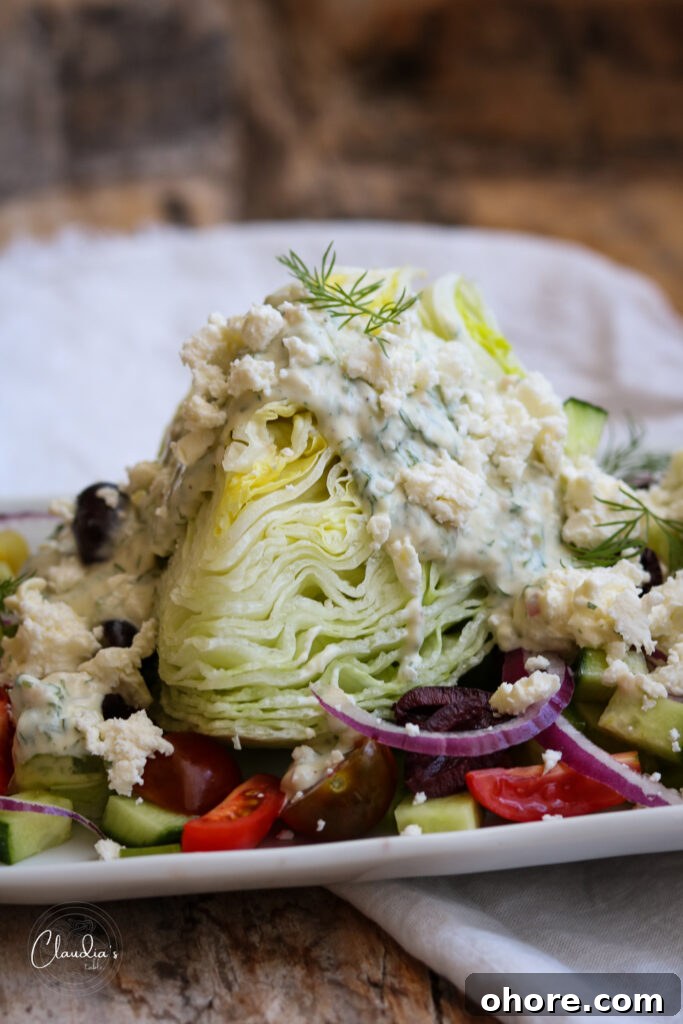 Greek Wedge Salad with Creamy Yogurt Dill Dressing 2 greek wedge salad on white plate with all the toppings