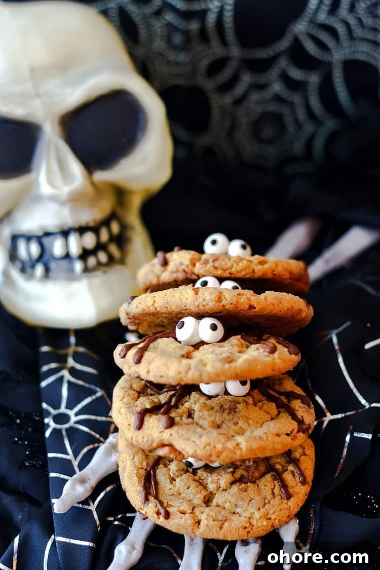 Malted Milk Ball Spider Cookies for Halloween Party Treats 2 A stack of spider cookies with their googly eyes peering out.