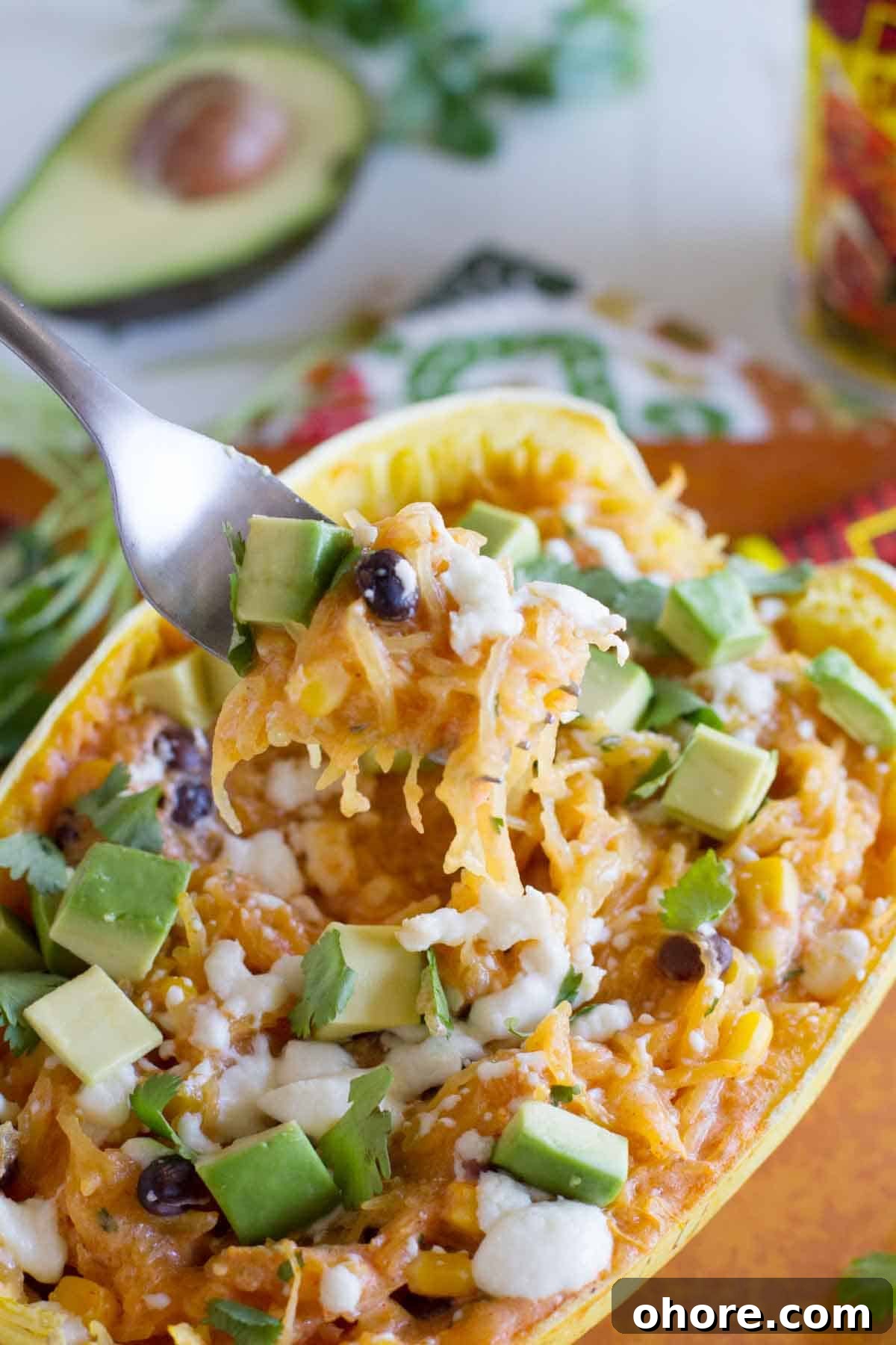 Southwestern-Stuffed Spaghetti Squash Recipe for Bold Flavor 5 Fork full of southwestern stuffed spaghetti squash.
