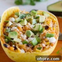 Southwestern-Stuffed Spaghetti Squash Recipe for Bold Flavor 6 Half of a spaghetti squash filled with beans, cheese, and enchilada sauce.