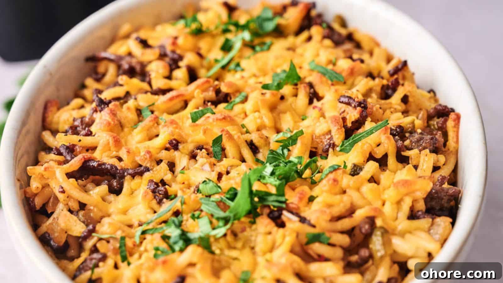 29 Cozy Air Fryer Casseroles for Warm January Dinners 12 A baked dish with pasta, ground beef, melted cheese, and topped with fresh parsley.