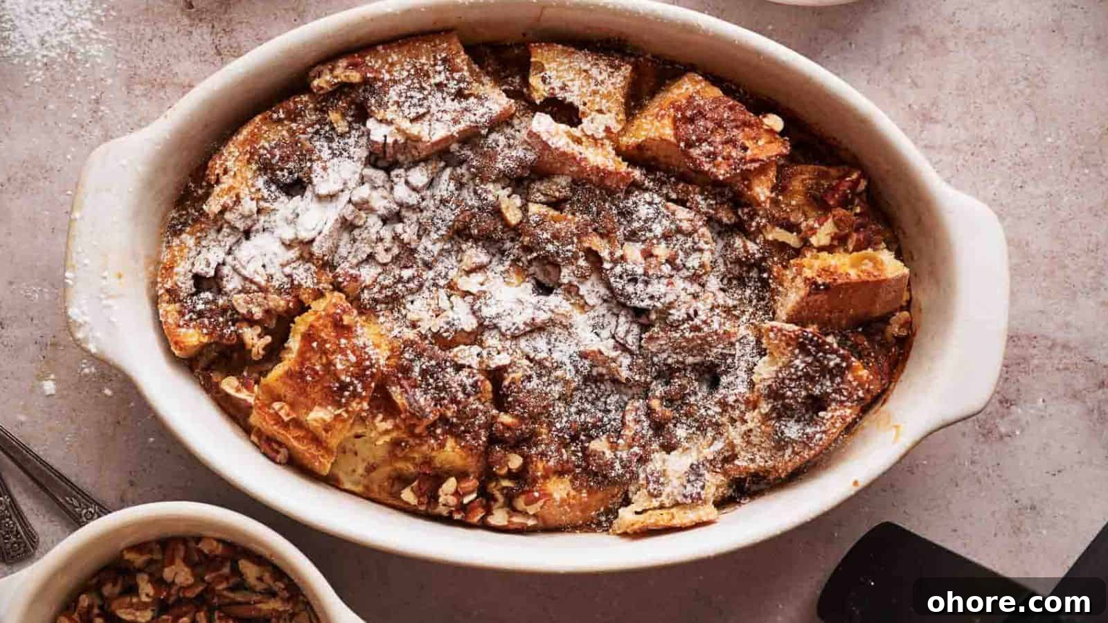 29 Cozy Air Fryer Casseroles for Warm January Dinners 13 A dish of French toast with pecans and powdered sugar.