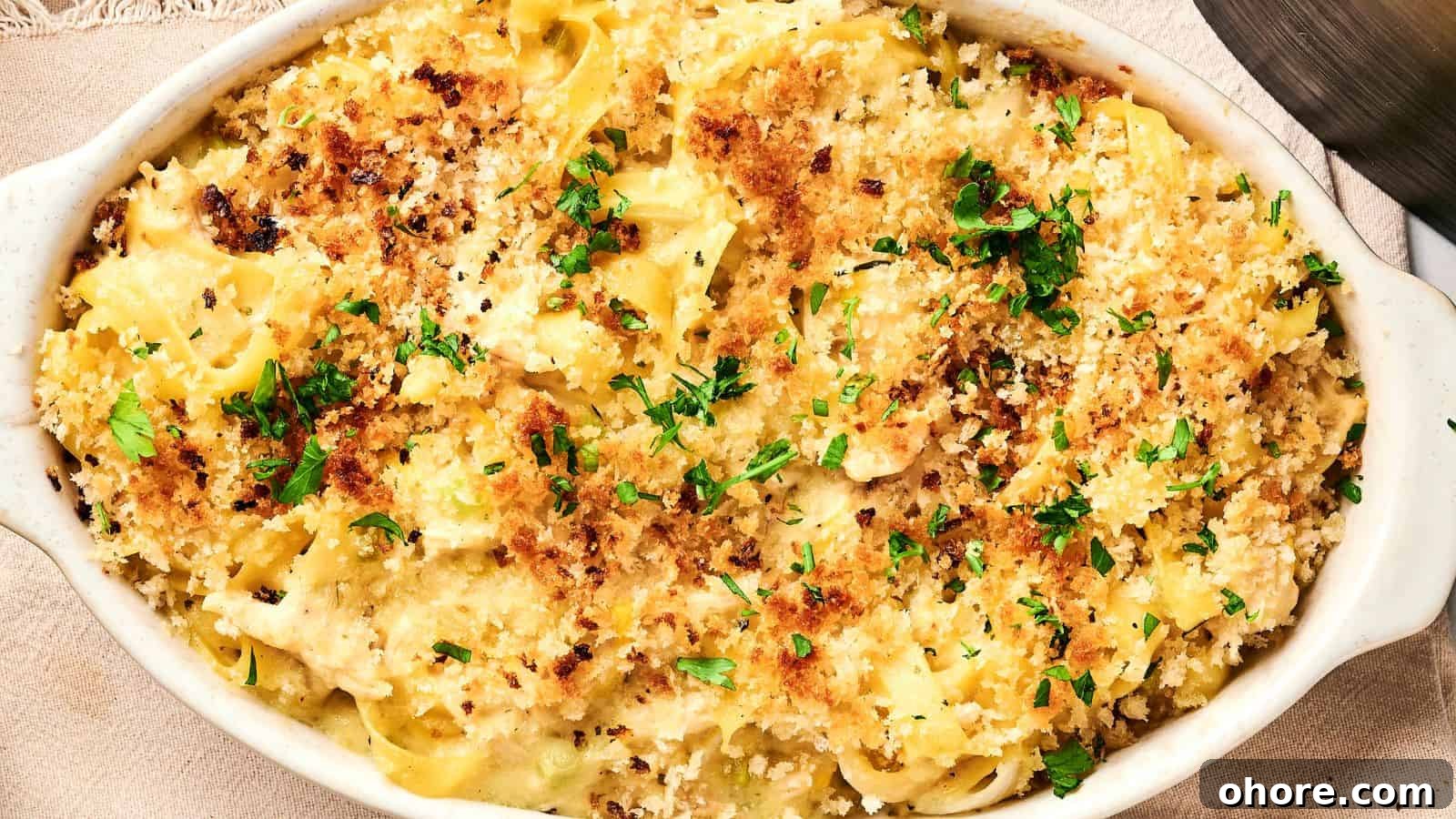 29 Cozy Air Fryer Casseroles for Warm January Dinners 19 Baked pasta in a white dish, topped with golden breadcrumbs and garnished with parsley.