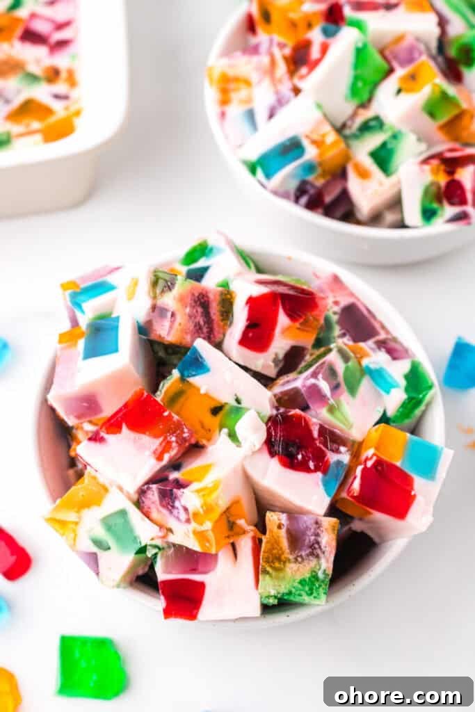 Retro Broken Glass Jello Recipe – Colorful Layered Dessert 2 Bowl of Broken Glass Jello dessert cubes with colorful gelatin pieces in creamy milk gelatin