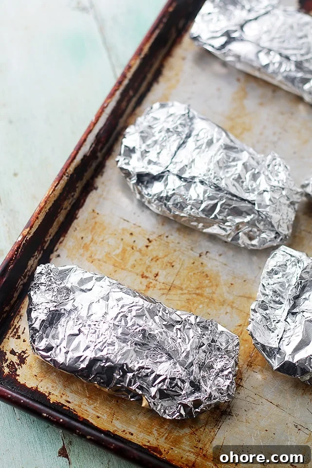 Italian Chicken and Vegetables In Foil | Flavorful, incredibly moist chicken baked in foil with peppers, onion, garlic, fresh herbs and Italian Dressing. Italian Chicken and Vegetables In Foil | Flavorful, incredibly moist chicken baked in foil with peppers, onion, garlic, fresh herbs and Italian Dressing.