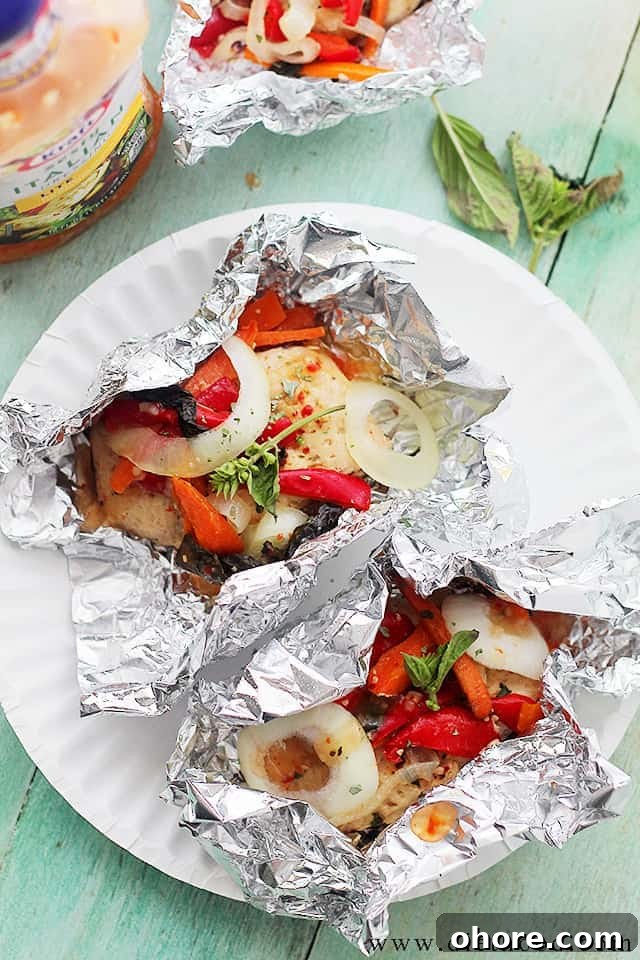 Italian Chicken and Vegetables In Foil | Flavorful, incredibly moist chicken baked in foil with peppers, onion, garlic, fresh herbs and Italian Dressing. Italian Chicken and Vegetables In Foil | Flavorful, incredibly moist chicken baked in foil with peppers, onion, garlic, fresh herbs and Italian Dressing.