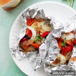 Italian-Style Foil-Baked Chicken with Vegetables 2 Italian Chicken and Vegetables In Foil | Flavorful, incredibly moist chicken baked in foil with peppers, onion, garlic, fresh herbs and Italian Dressing.