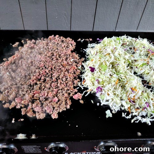 Blackstone Griddle Egg Roll in a Bowl Recipe 5 Cooked Ground Pork Sausage and coleslaw on blackstone griddle