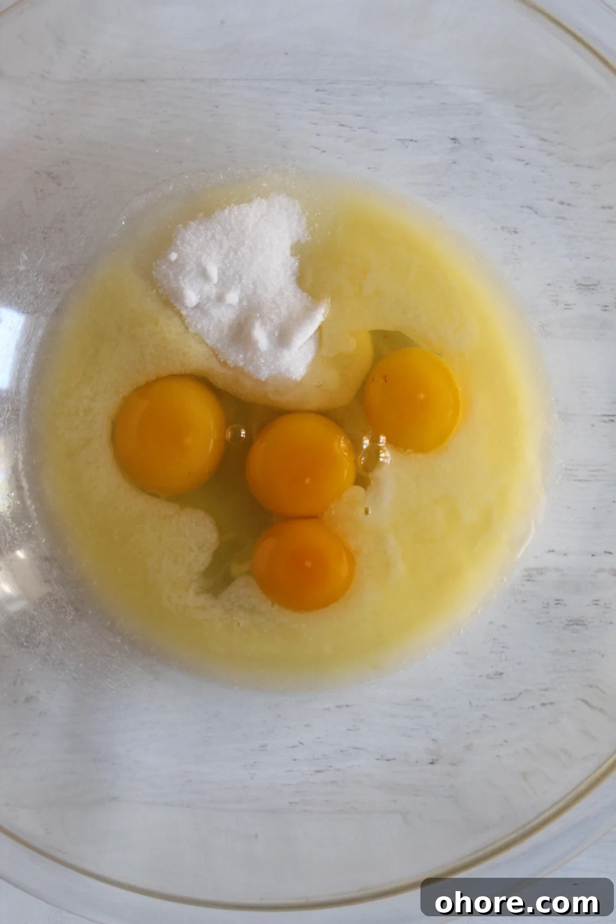 Almond Flour Cornbread: Dairy-Free, Gluten-Free Recipe 6 eggs, sugar, and melted butter in a glass bowl