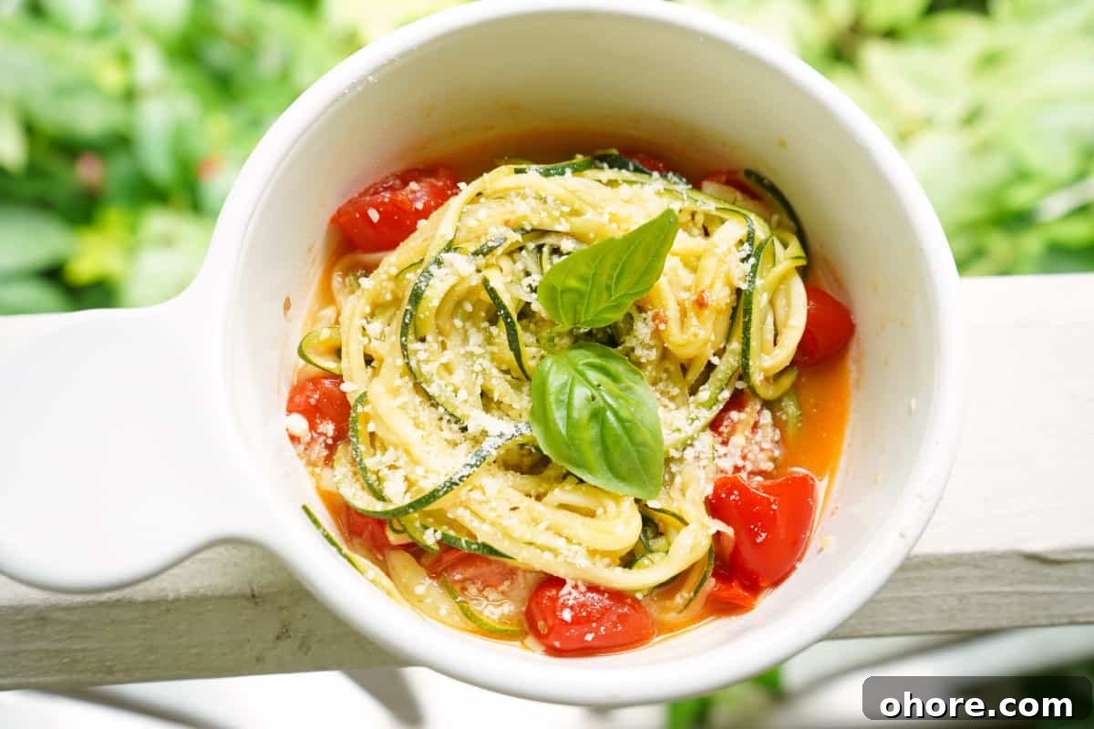 Zucchini noodles in white bowl Zucchini noodles in white bowl