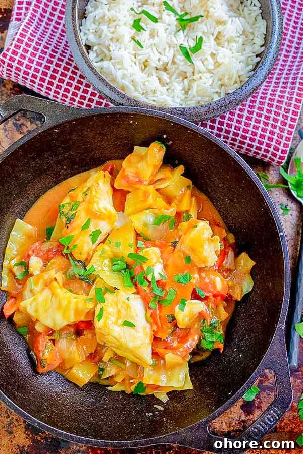 32 Gluten-Free Recipes That Support Weight Loss Goals 16 caribbean fish curry in a skillet with a side of rice
