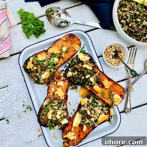 Birds-eye-view of four roasted curried butternut squash on a rectangular white tray