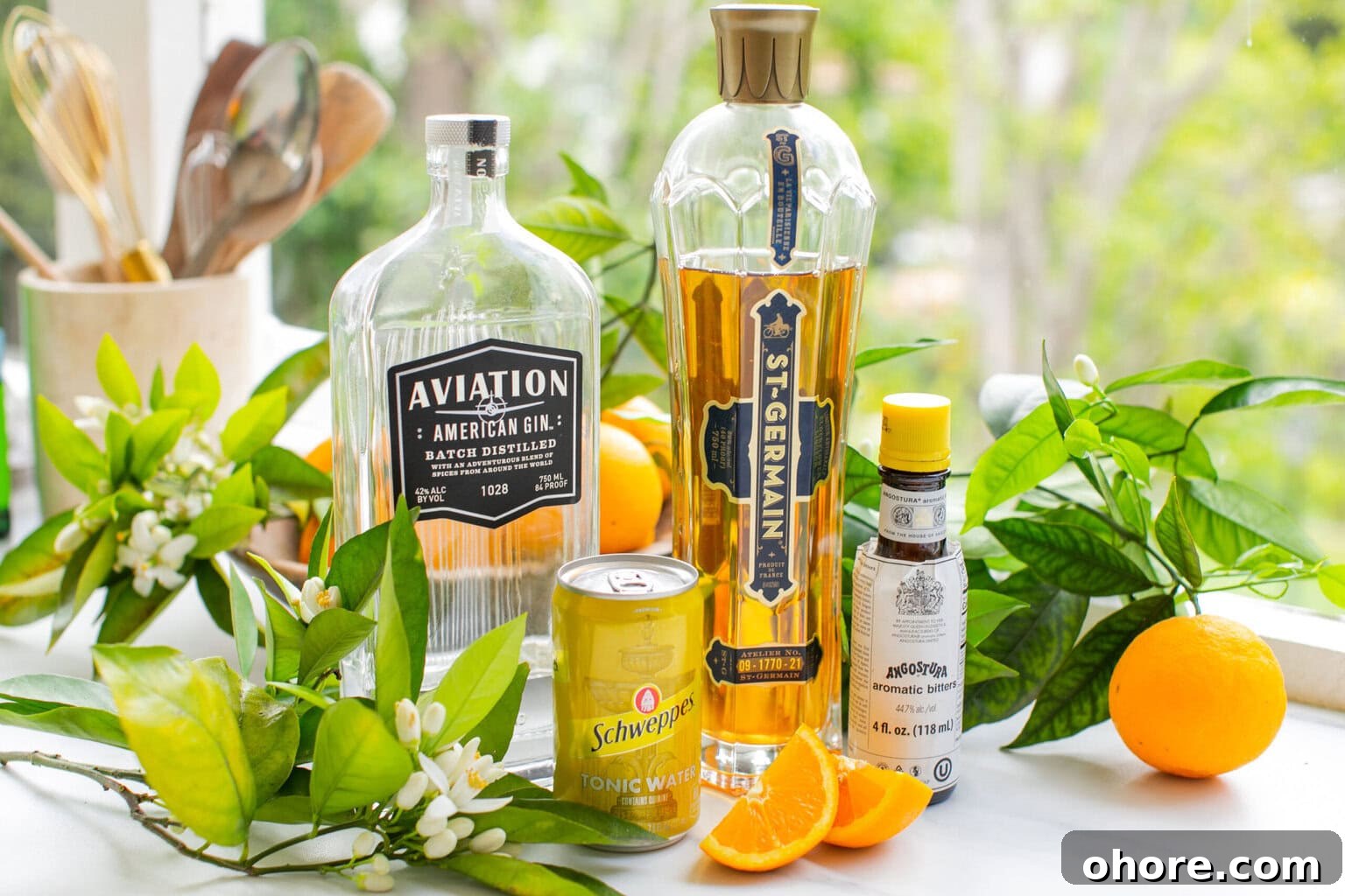 Orange Blossom Gin & Tonic Recipe — Floral G&T Cocktail Guide 3 gin, elderflower liqueur, oranges, schweppes tonic water, and orange blossoms