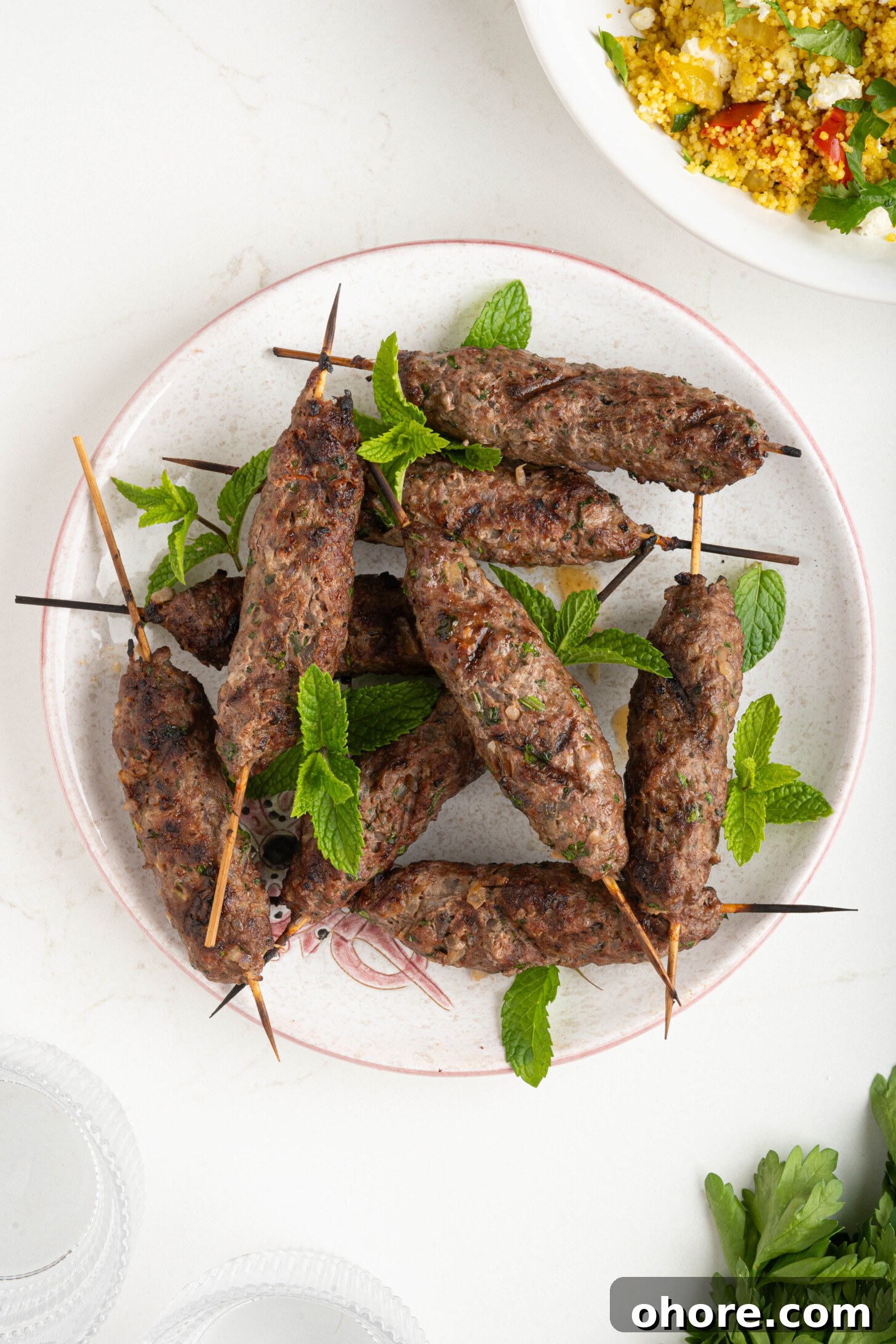 30-Minute Moroccan Kefta Brochettes Recipe — Grilled Lamb Skewers 2 a plate of Moroccan grilled kefta
