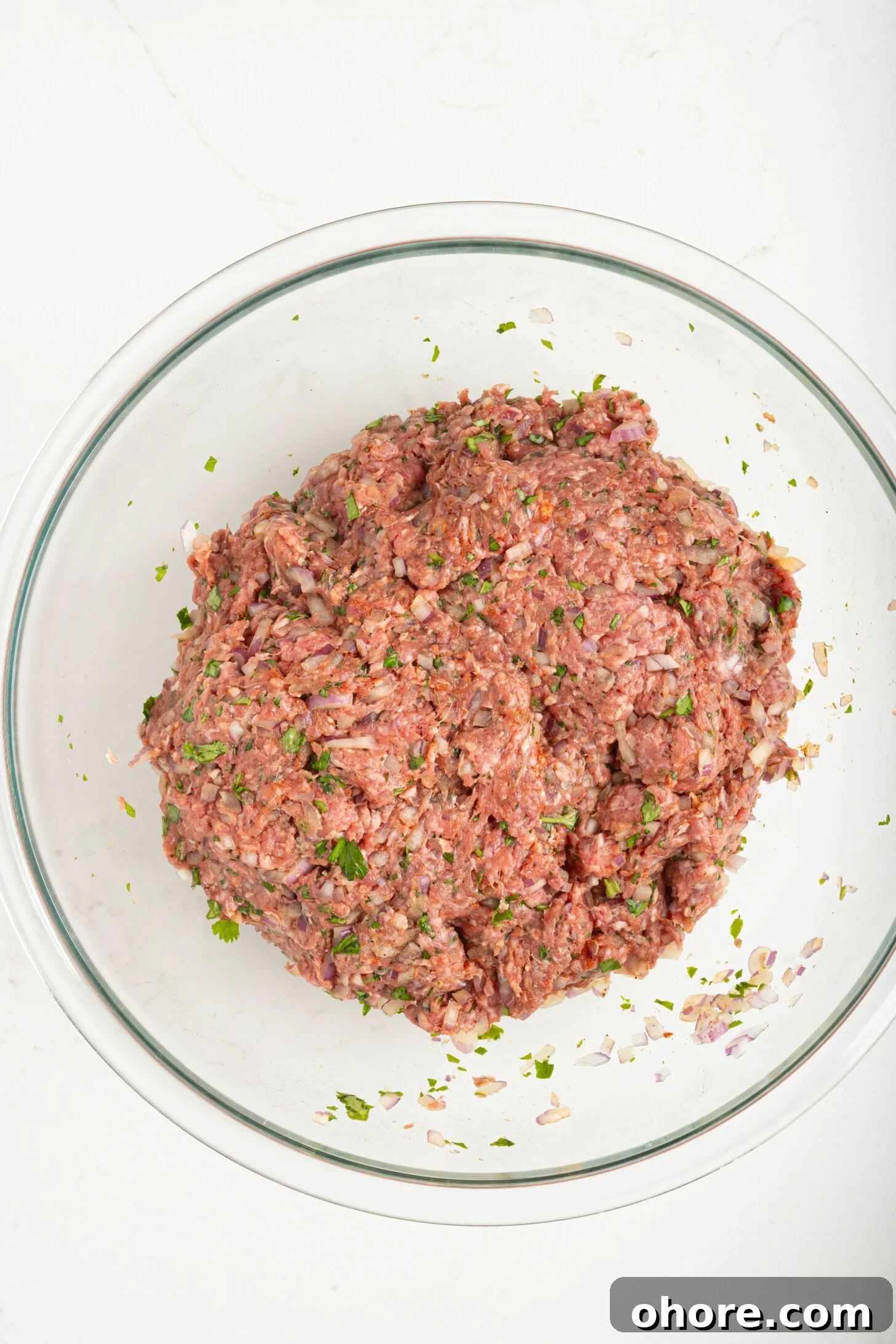 30-Minute Moroccan Kefta Brochettes Recipe — Grilled Lamb Skewers 5 a bowl of raw kefta meat