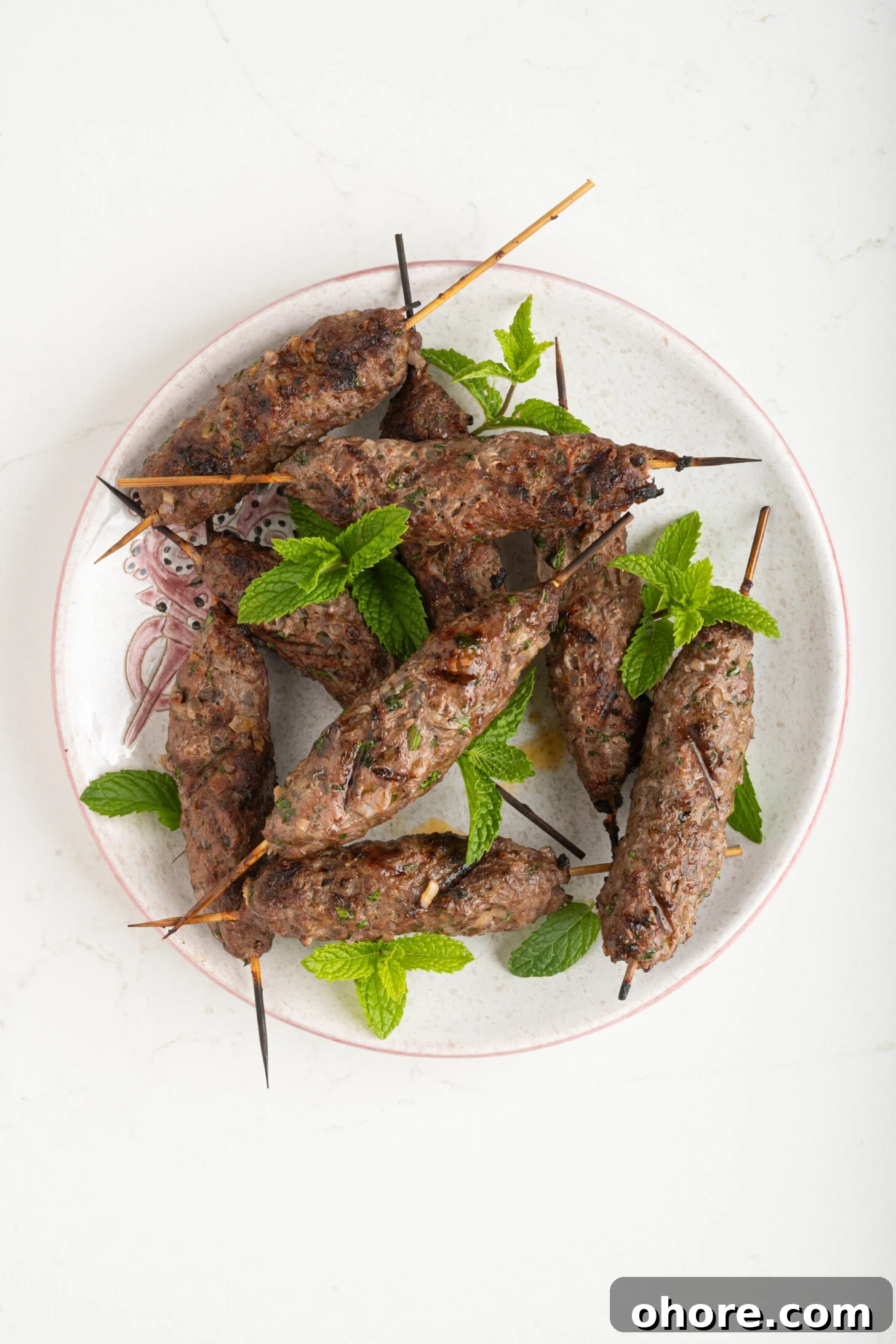 30-Minute Moroccan Kefta Brochettes Recipe — Grilled Lamb Skewers 8 a plate of Moroccan grilled kefta