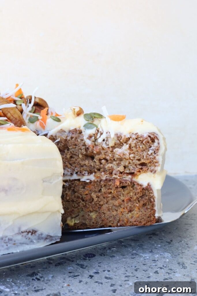 Sourdough Recipes for a Romantic Valentine’s Day Meal 27 A delicious sourdough carrot cake that has a slice cut out of it to show the moist inside.