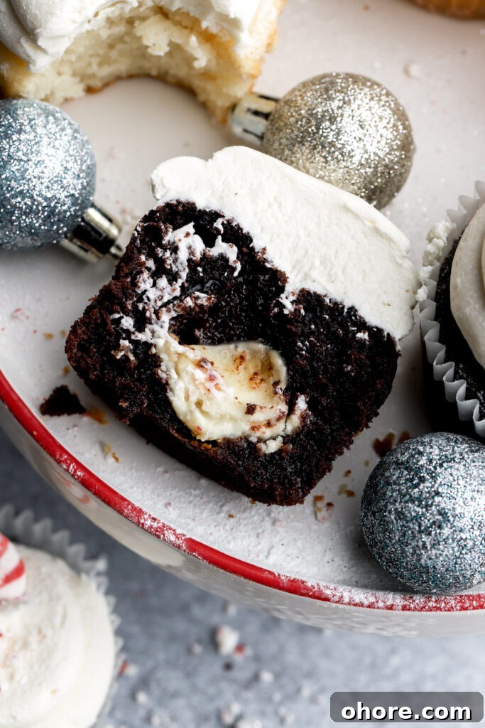 Refreshing Peppermint Cupcakes Recipe with Creamy Frosting 13 chocolate peppermint cupcake cut in half with white chocolate peppermint truffle inside