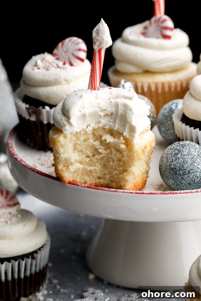 Refreshing Peppermint Cupcakes Recipe with Creamy Frosting 17 bite taken out of white chocolate peppermint cupcakes