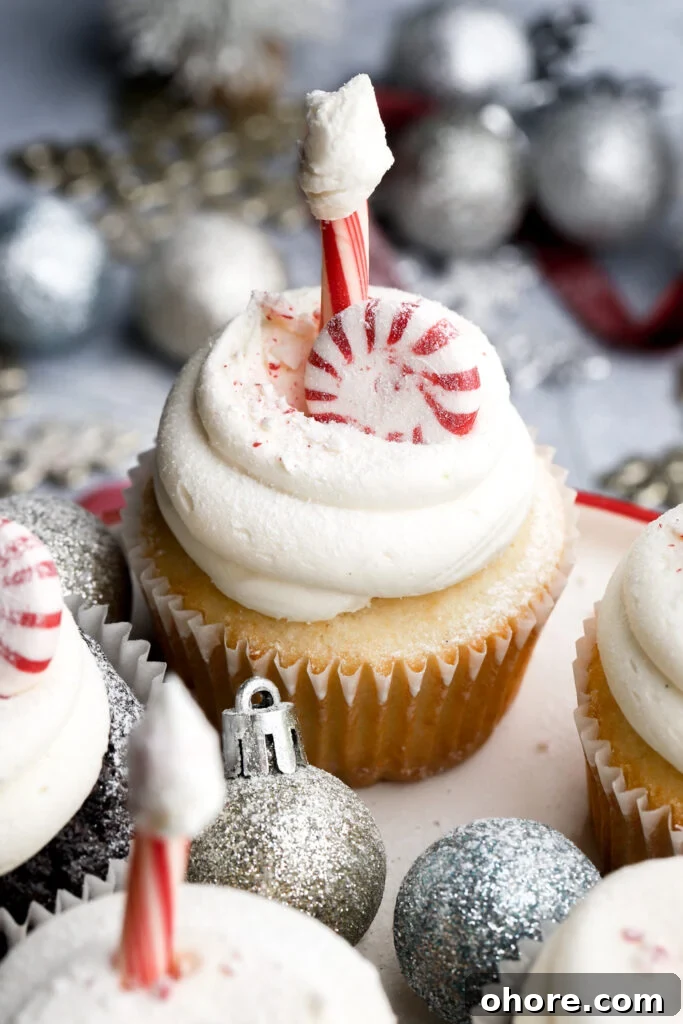 Refreshing Peppermint Cupcakes Recipe with Creamy Frosting 3 white chocolate peppermint cupcakes frosted with north pole decoration