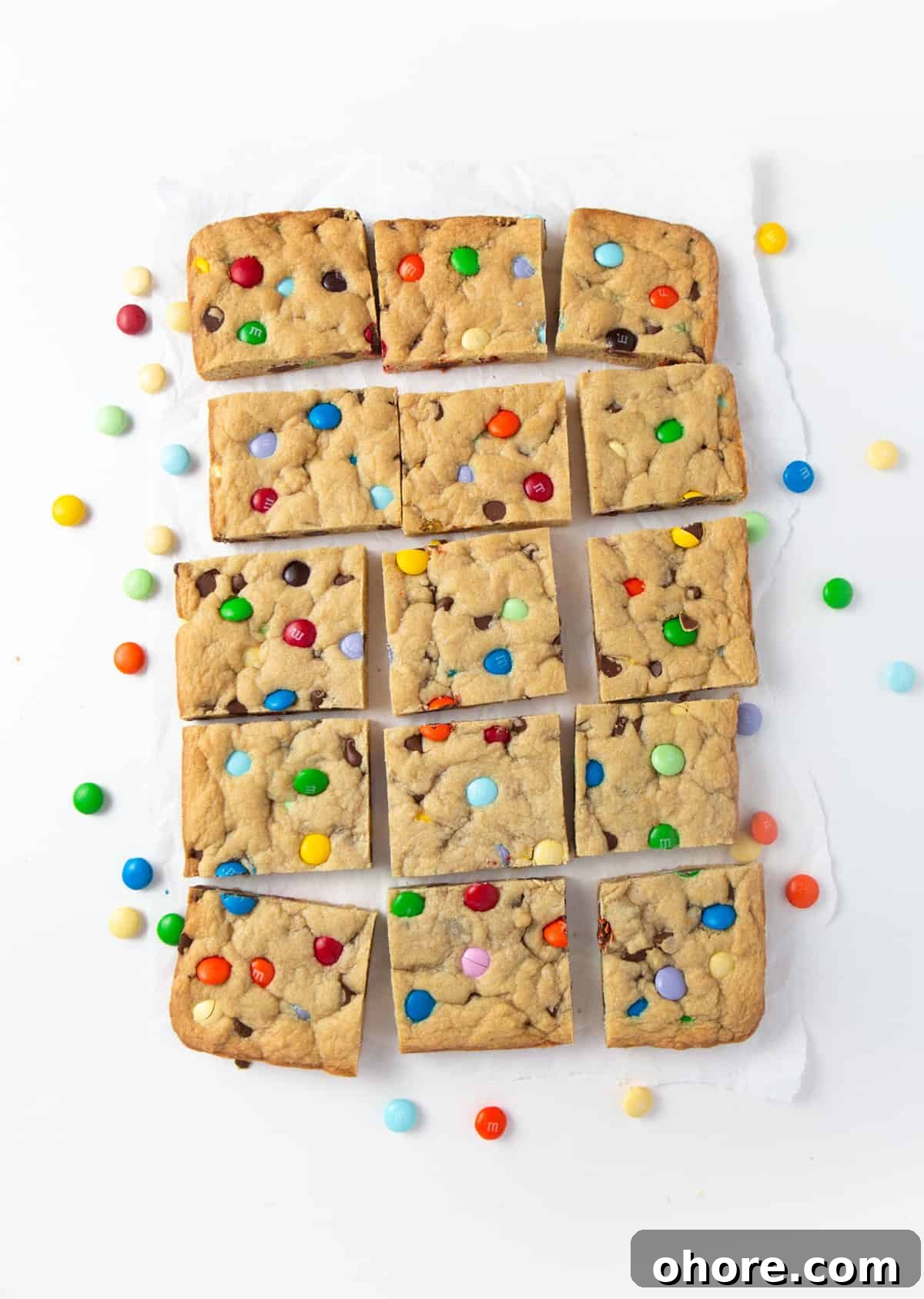 Chewy M&M Cookie Bars Recipe — Loaded Candy Cookie Bars 2 Chewy M&M Cookie bars cut into squares