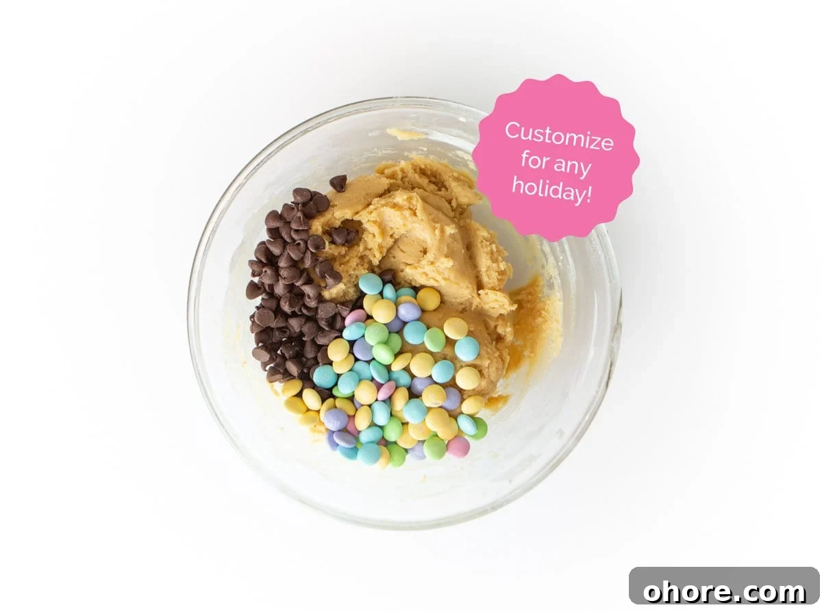 Chewy M&M Cookie Bars Recipe — Loaded Candy Cookie Bars 11 Bowl of chocolate chip cookie dough with easter M&m's