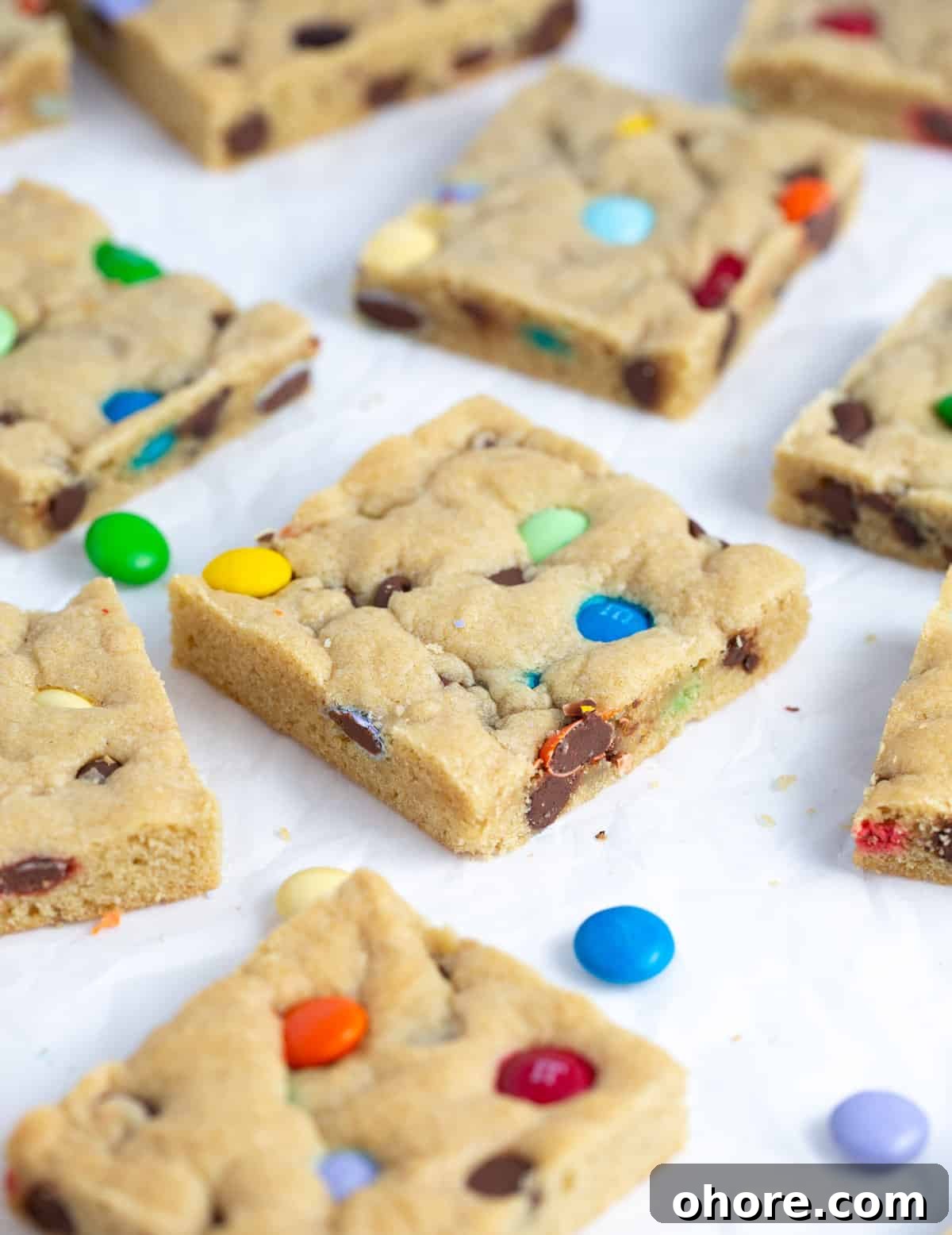 Chewy M&M Cookie Bars Recipe — Loaded Candy Cookie Bars 4 Chewy M&M Cookie bars cut into squares