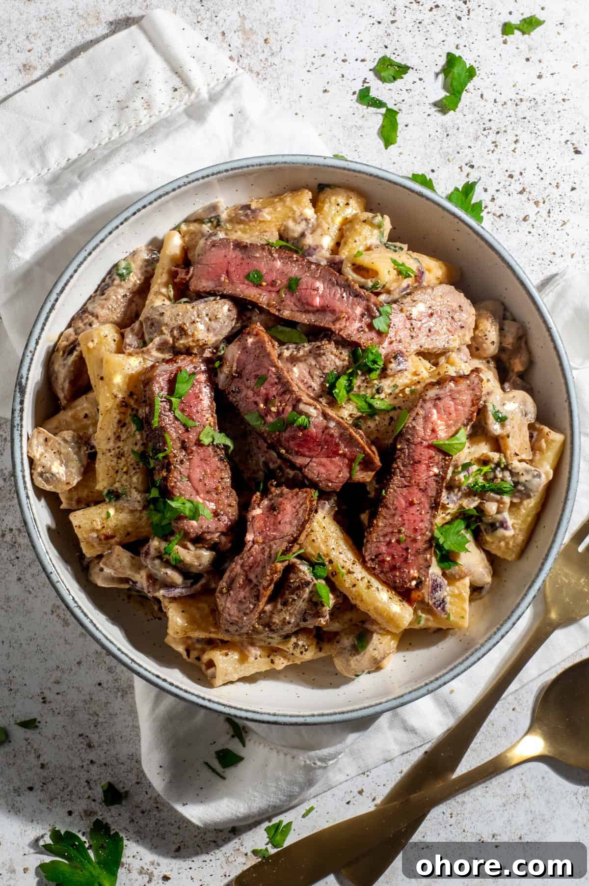 Creamy steak pasta with mushroom whisky sauce in a bowl