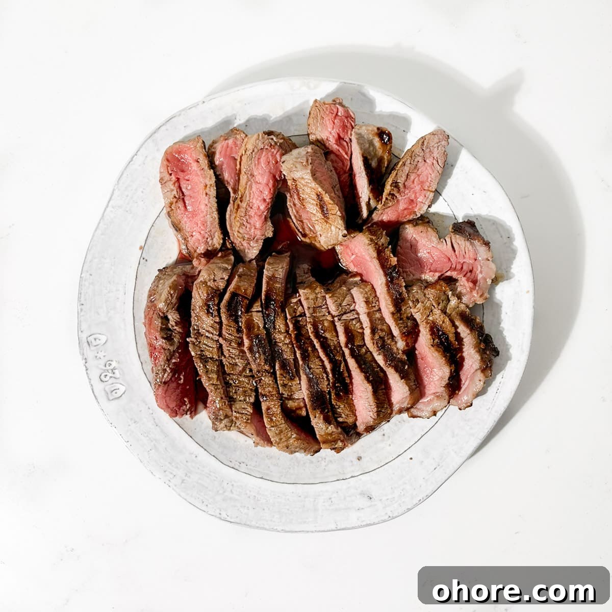 Cut steak on a plate for the creamy steak pasta.