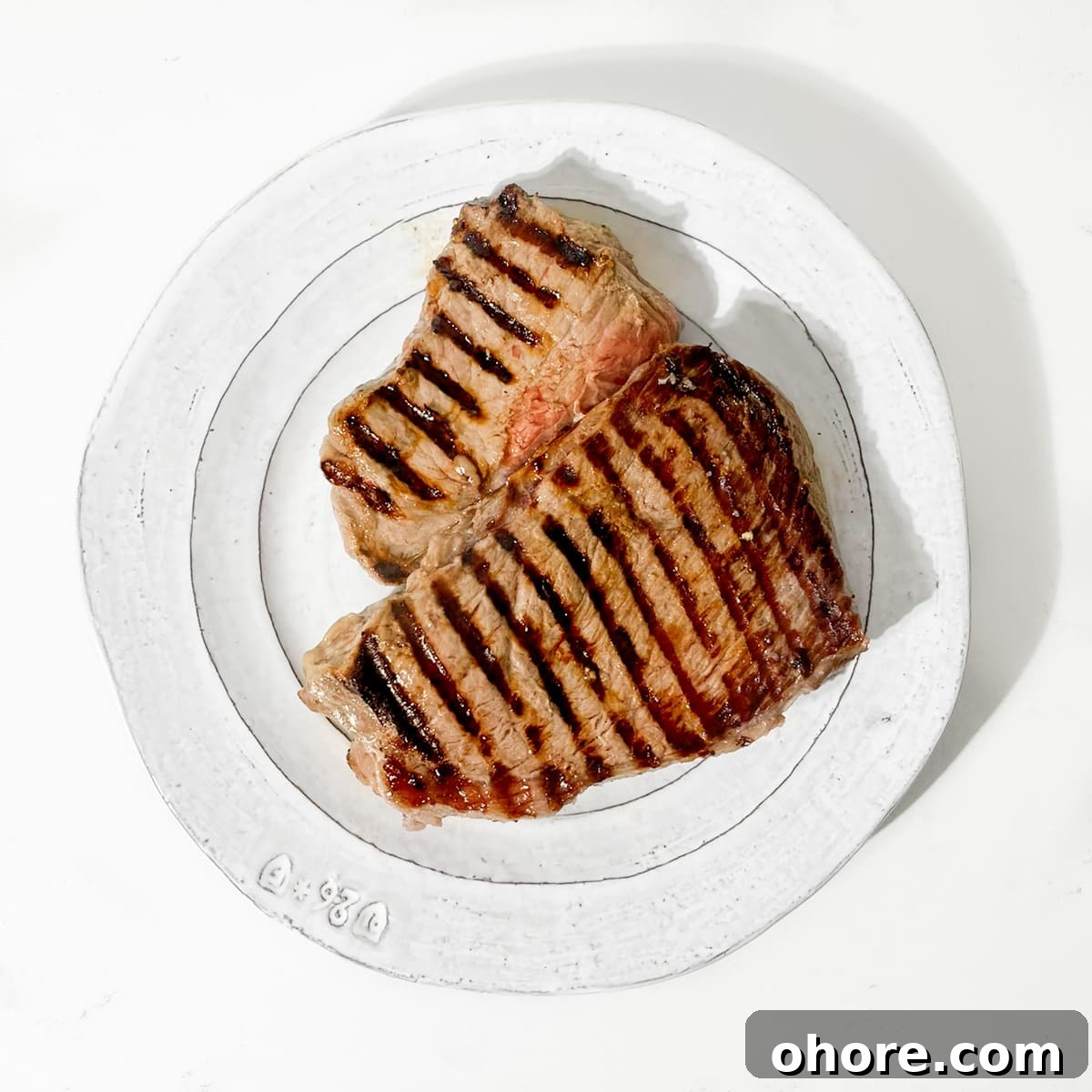Cooked steak on a plate.