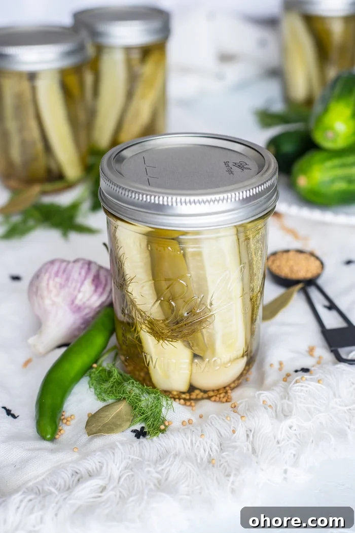 Dill Pickles Spears are easily made right in your own kitchen! dill pickle recipe for canning in a mason jar