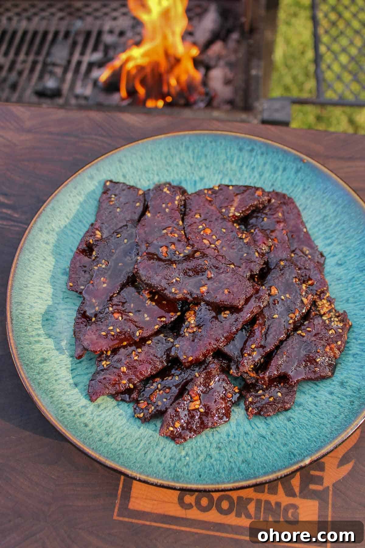 Spicy Honey Garlic Beef Jerky Recipe for Homemade Snacks 8 A pile of jerky stacked on a plate.