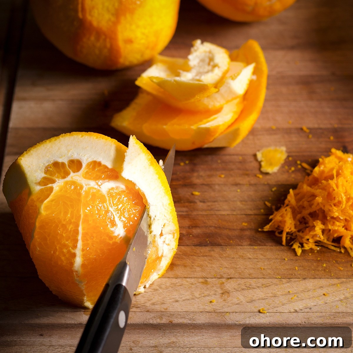 Orange Poppy Seed Cake with Mascarpone Frosting Recipe 8 Using a sharp knife to slice the peel from an orange.