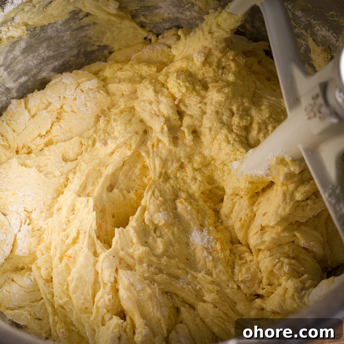 Orange Poppy Seed Cake with Mascarpone Frosting Recipe 13 Slowly mixing the dry ingredients into the cake batter.