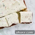 Easy Pineapple Cake made with crushed pineapple and topped with a rich cream cheese frosting.